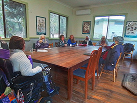 Writers retreat sharing around the table